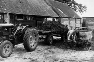 Historical photo showing a working farm
