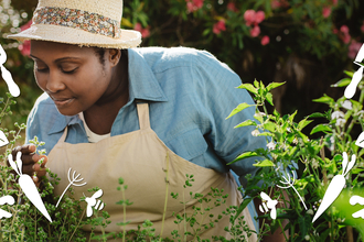 A gardener in their garden