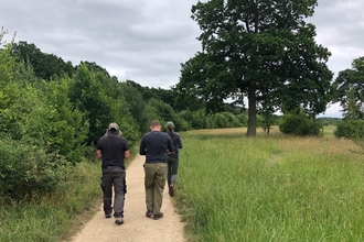 Men walking at Bay Meadows