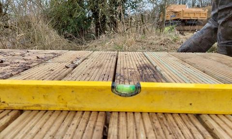 Spirit level on top of boardwalk