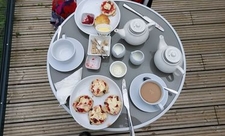 A photo of tea and cakes