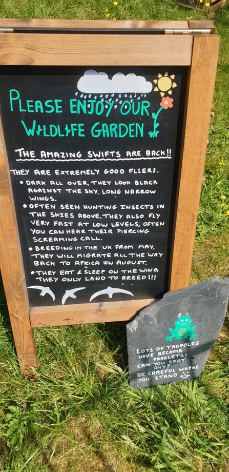 Sign reads 'please enjoy our wildlife garden'