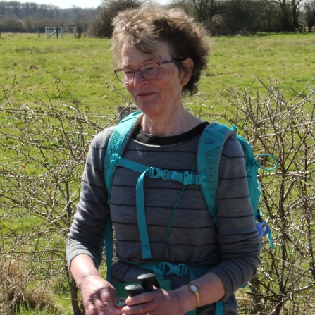 Christine Rolt smiling on a nature reserve