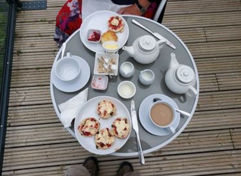 A photo of tea and cakes