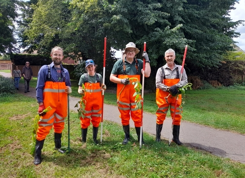 Staff and volunteers in waders