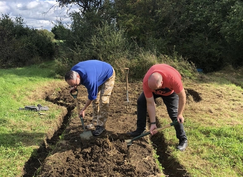 Men prepping a path on a nature reserve